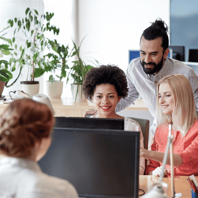 group of people around a computer